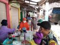 Polsek Kenjeran Kawal Pelaksanaan Vaksinasi Covid-19 di Pasar Podomoro