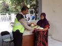 Babinkamtibmas Perak Utara Amankan Pembagian Bantuan di Kelurahan