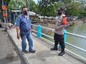 Polsek Pabean Cantikan Pantau Debit Air di Sungai Kalimas, Waspada Bahaya Banjir