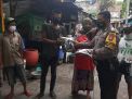 Babinkamtibmas Krembangan Utara Bagikan Kaos Bertuliskan Seruan Bermasker