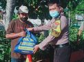 Babinkamtibmas Tambak Wedi Bagikan Bantuan Sembako Dari AKPOL 95