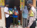 Babinkamtibmas Perak Timur Laksanakan Pengamanan Pengambilan Bantuan Sembako