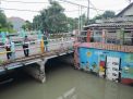 Polsek Kenjeran Laksanakan Patroli Pengecekan Pintu Air Kejawan, Terpantau Masih Dalam Debit Normal