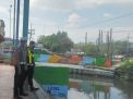 Polsek Asemrowo Laksanakan Pemantauan Ketinggian Debit Pompa Air dan Sungai, Antisipasi Potensi Banjir