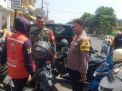 Bhabinkamtibmas Ampel Sampaikan Himbauan Terkait Tarif Parkir Demi Ketertiban
